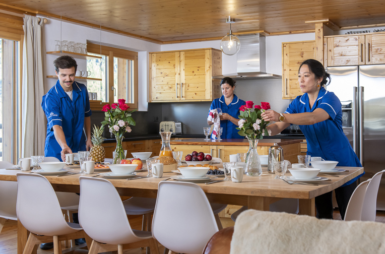 Preparing the dining area of a chalet